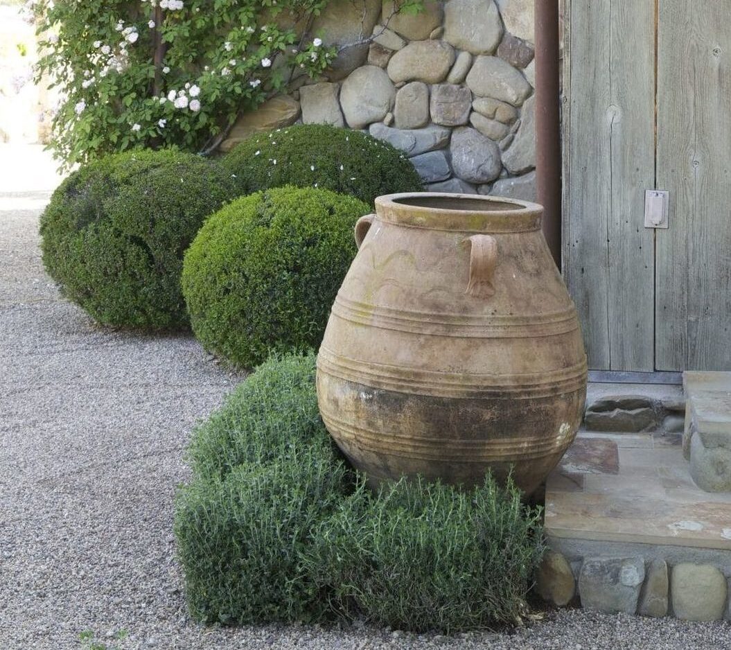 greek pithari planter in garden