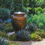 garden water feature with greek planter