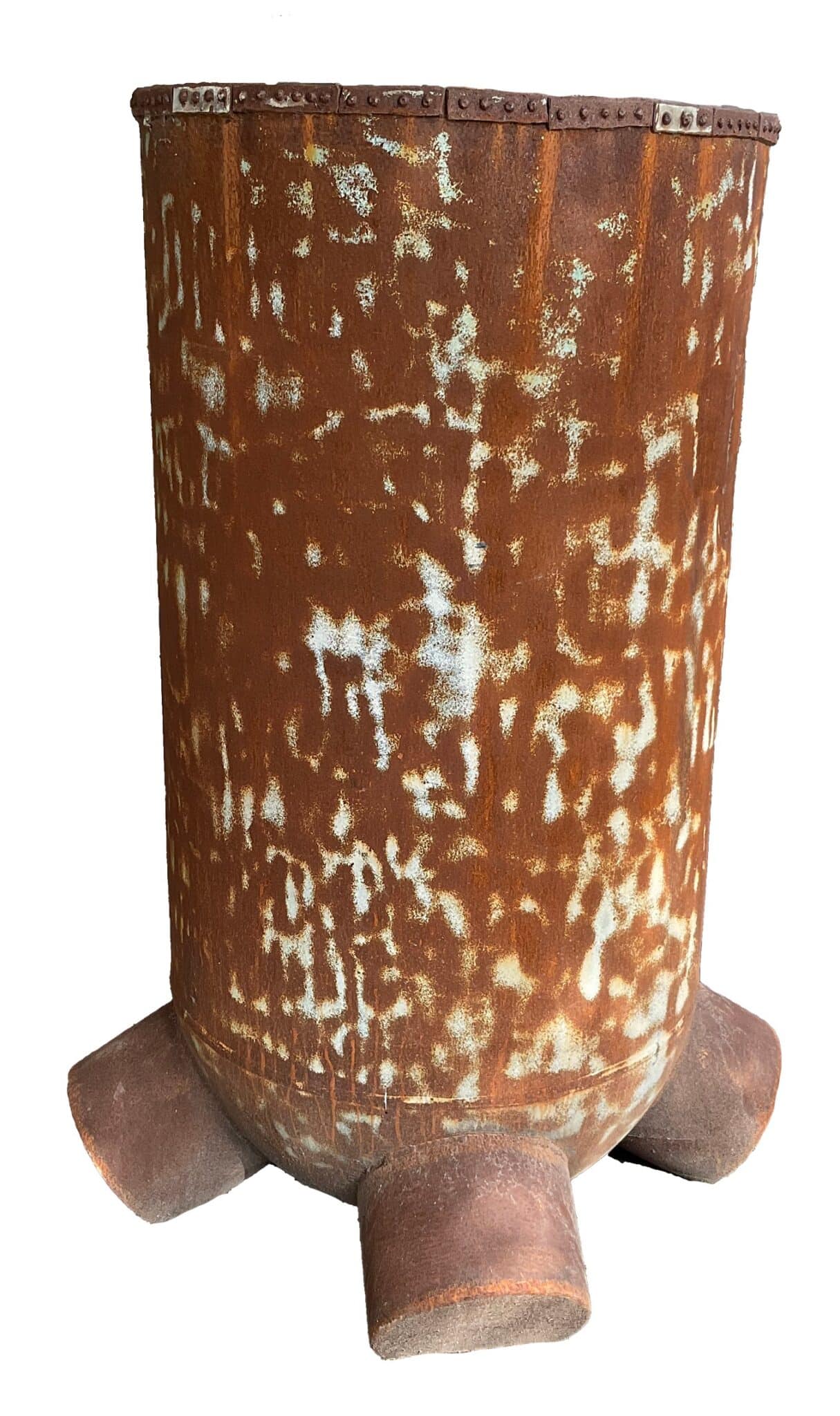 Tall cylindrical rusted steel planter with a riveted rim and three short block feet, weathered with teal-green patina
