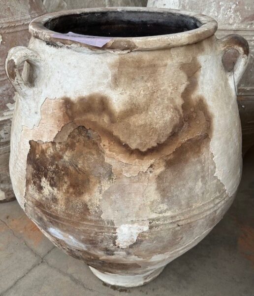 vintage Greek Pithari oil jar with a dark natural patina on remaining white washed surface