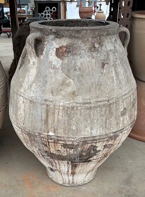 vintage Greek Pithari oil jar with a dark natural patina on remaining white washed surface