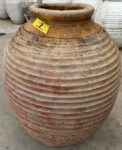 vintage Greek Peloponesian oil jar with a weathered patina
