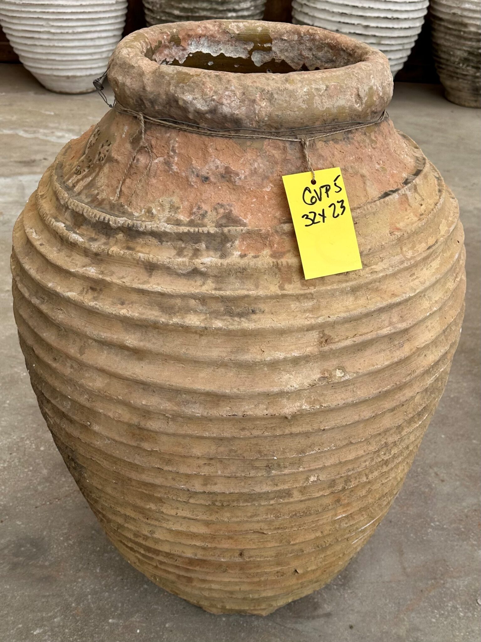 vintage Greek Peloponesian oil jar with a weathered patina