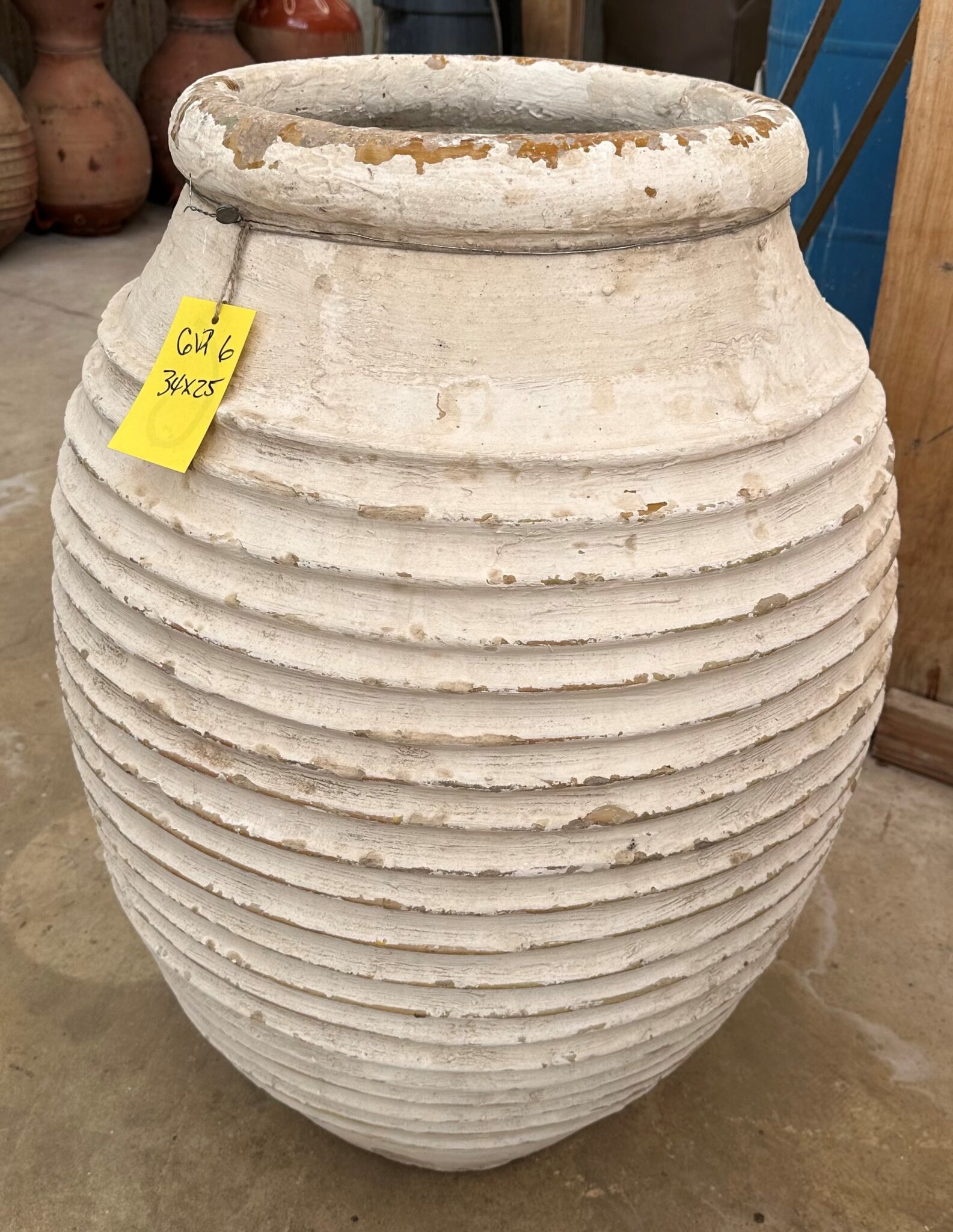 vintage Greek Peloponesian oil jar with a lightly weathered white wash surfaced