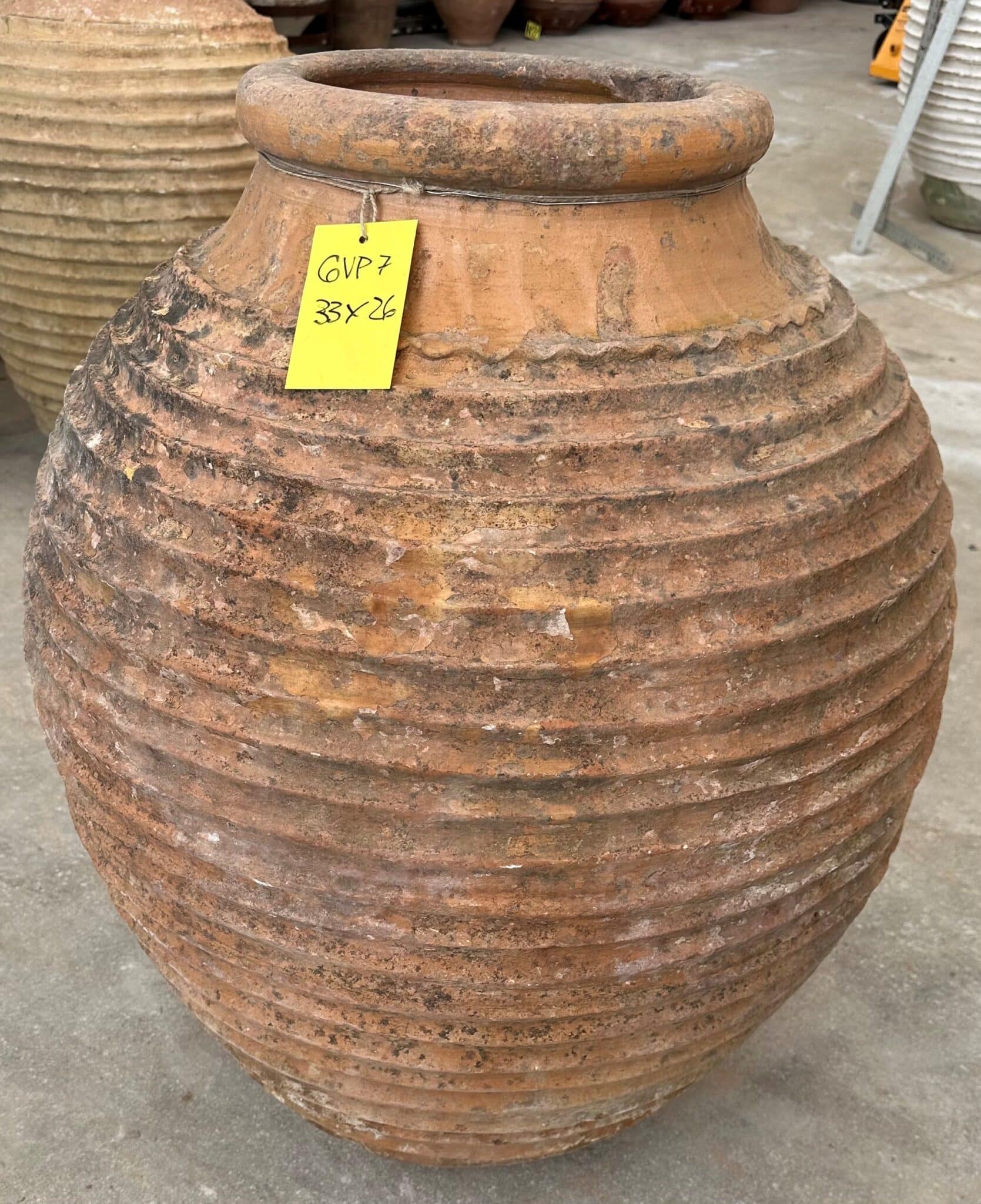 vintage Greek Peloponesian oil jar with a weathered patina