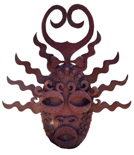 an elaborate abstract mask with ray like shapes radiating from the sides