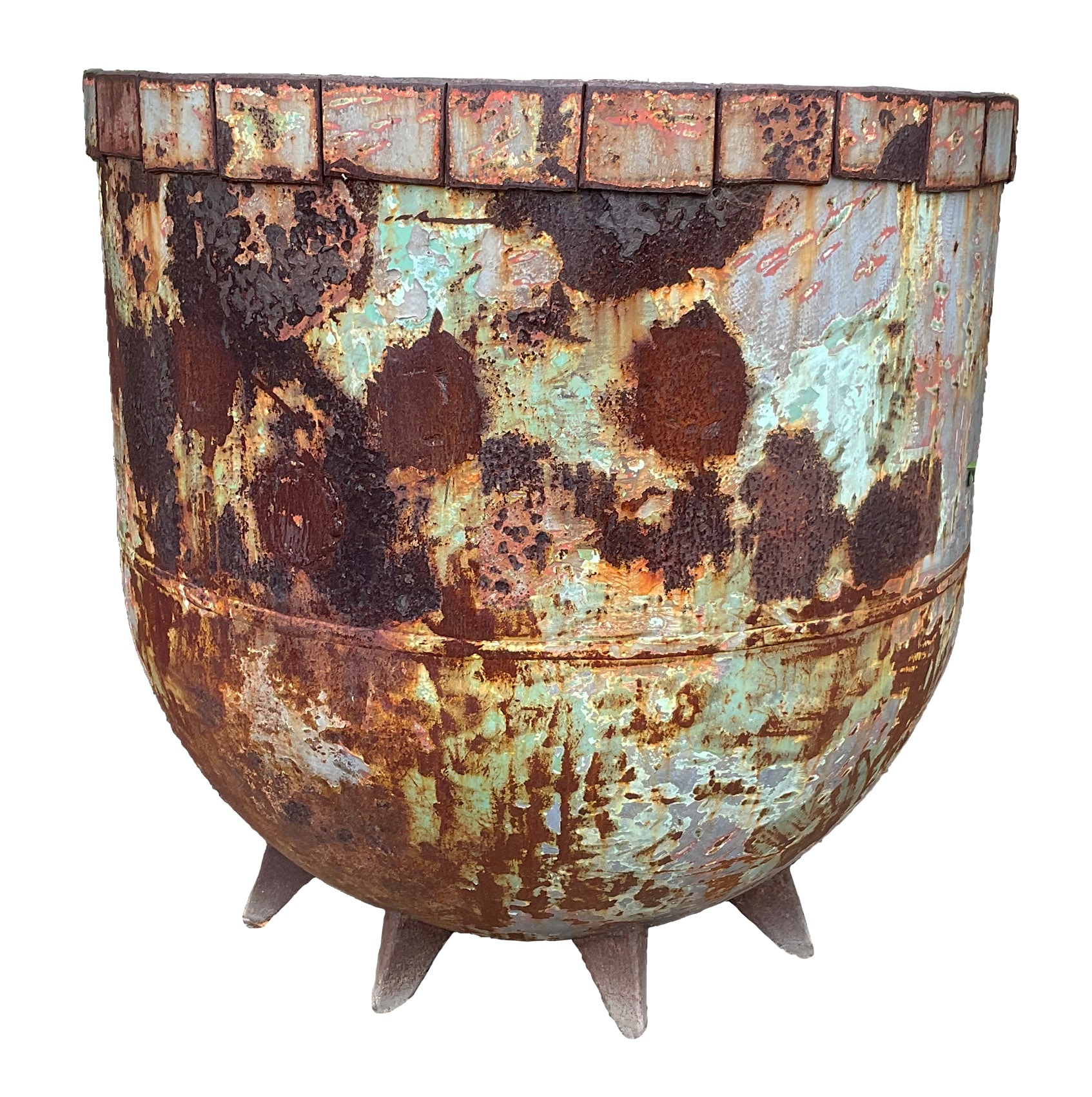 Wide rounded rusted steel planter with a riveted brick-pattern rim and splayed pointed feet, weathered with teal-green patina