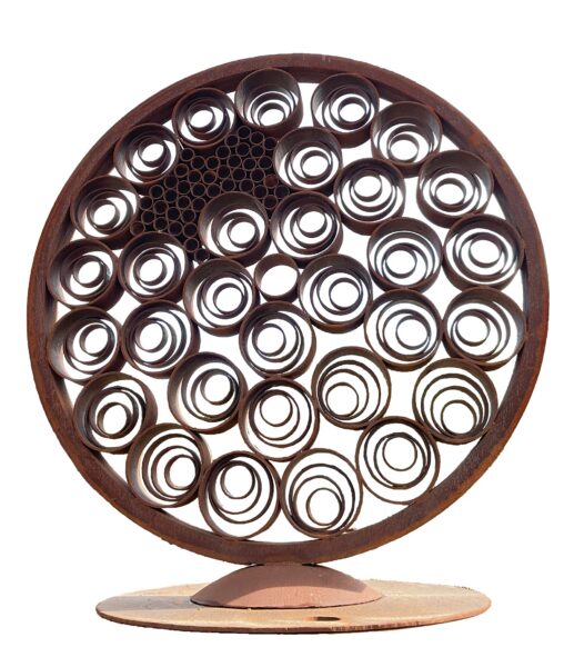 Round rusted steel sculpture on a stand featuring dozens of overlapping ringed circles in a bubble-like pattern, with a cluster of small tube openings at center