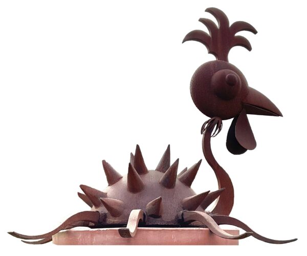 Whimsical rusted steel chicken sculpture with a curved feathered tail, round textured body, and spiked comb, perched with long tendrils extending from body