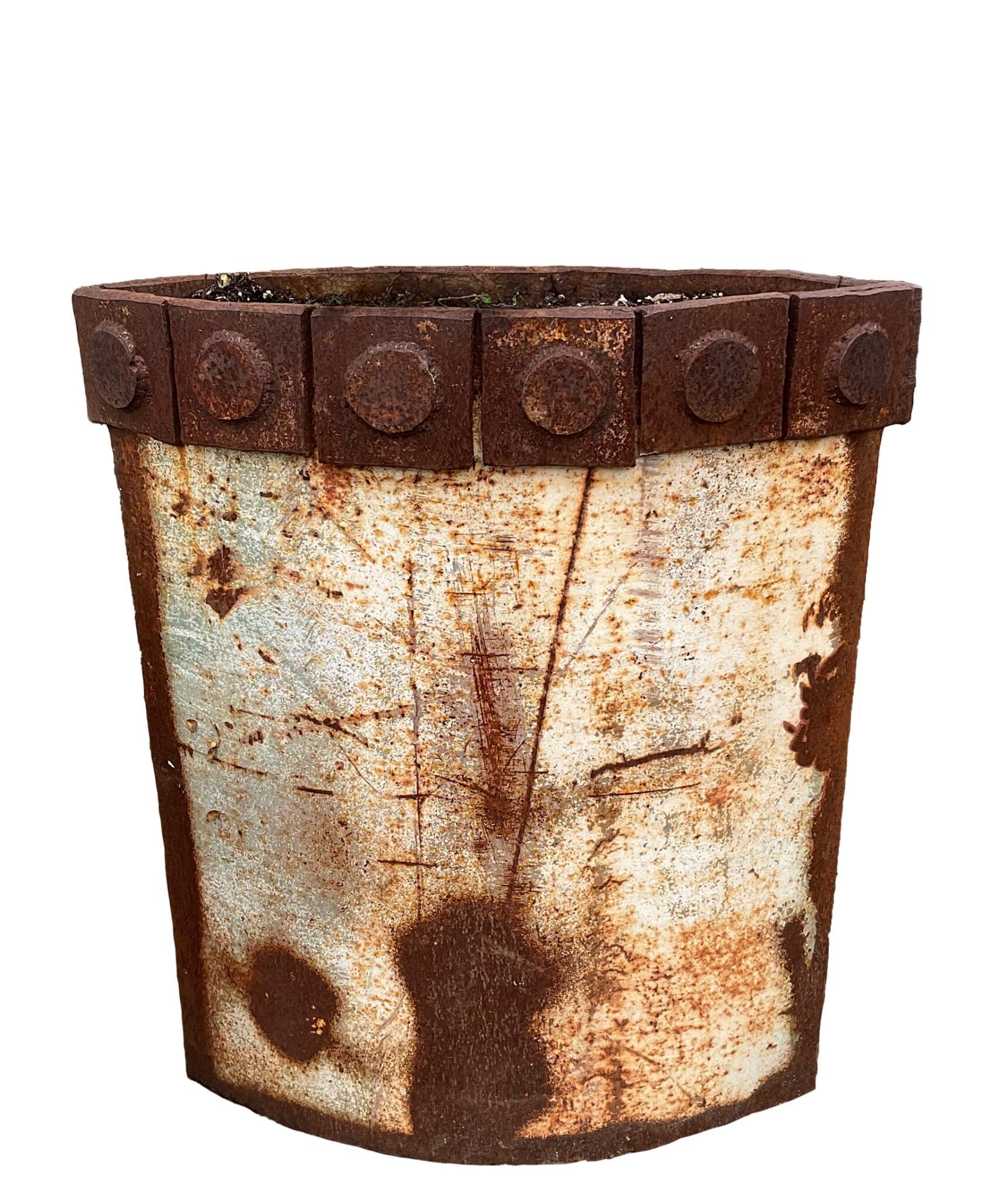 Tall cylindrical planter made of upcycled metal with weathered multicolor paint patina, raised banded rim, and four ring-shaped feet.