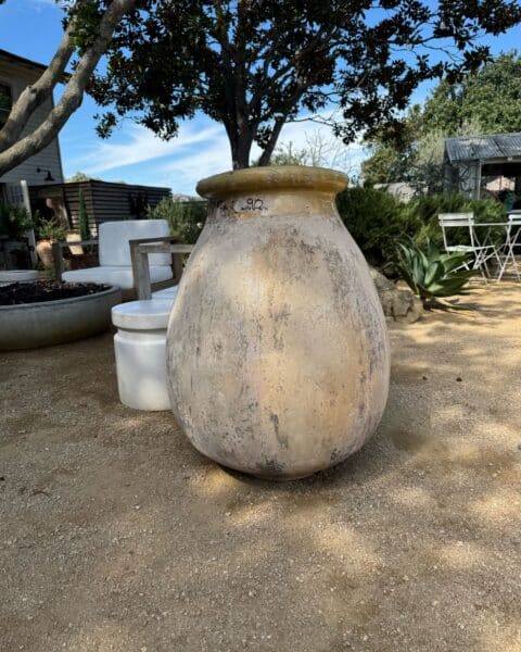 intage French Biot jar on display on the patio at Eye of the Day Los Alamos garden.